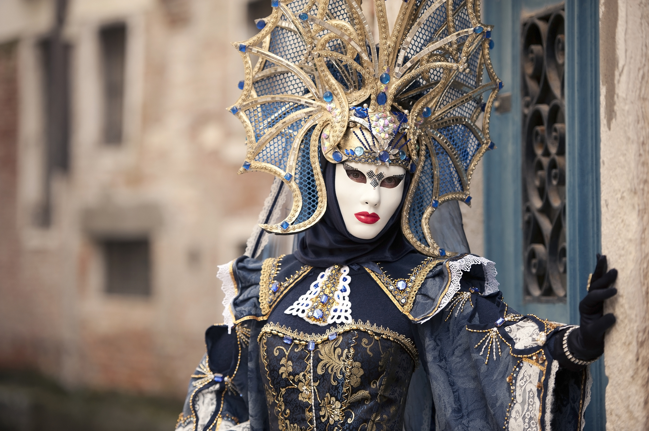 Elegant people in masquerade carnival mask at Venice Carnival